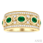 4x3 MM Oval and 2.8 MM Round Cut Emerald and 3/8 Ctw Curvy Criss-Cross Single Cut Diamond Precious Band in 14K Yellow Gold